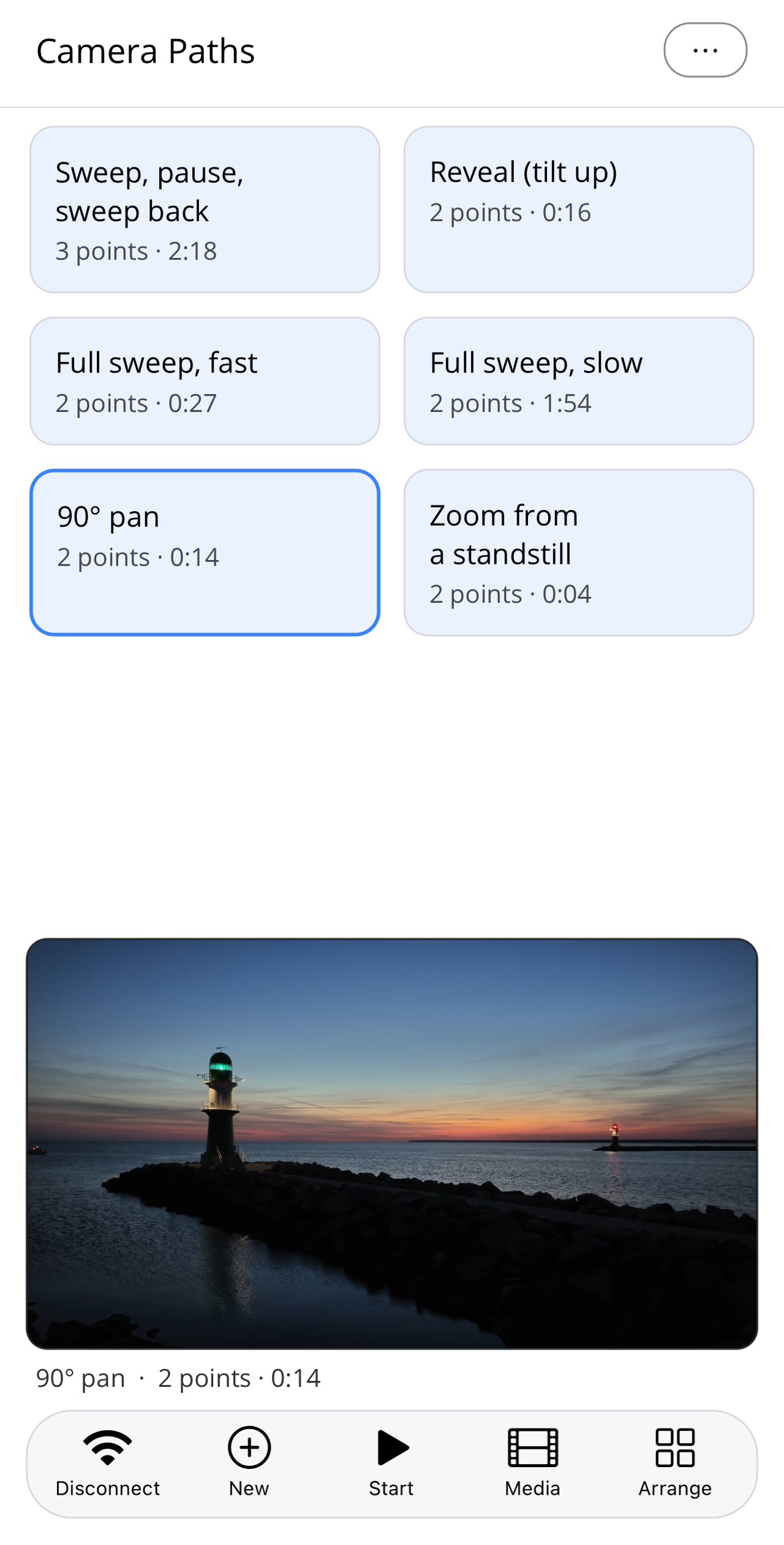 Pathset home screen with the selected, blue-outlined tile "90° pan"; above the bottom bar the camera's live view with two pier lights at dawn.